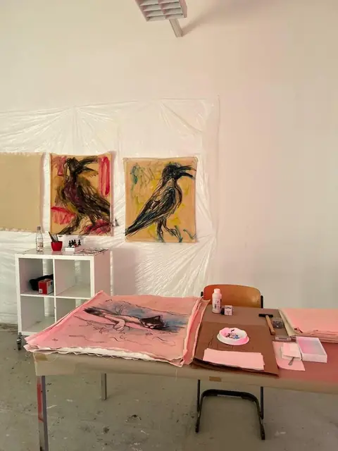 Crows on the wall and a cat drawing on the table