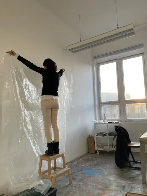 Covering the walls in plastic before the work begins