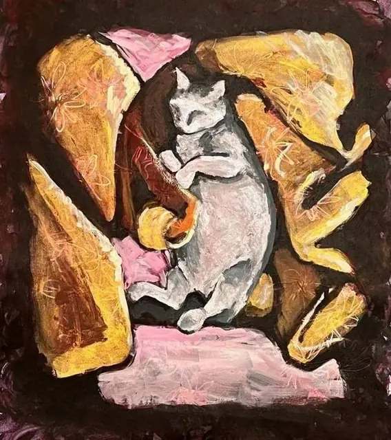 A white cat asleep in golden cushions
