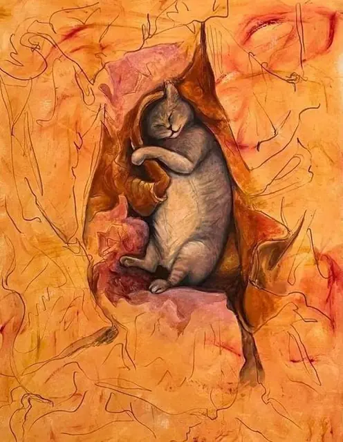 A cat asleep in orange