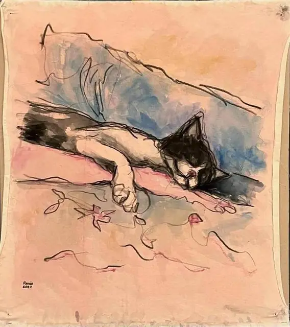 A cat asleep on the sofa