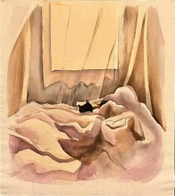 A cat hidden in the sheets