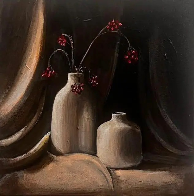 Two white vases with red berries