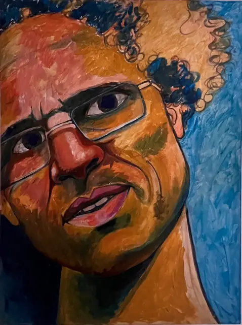 A face in glasses, looking up