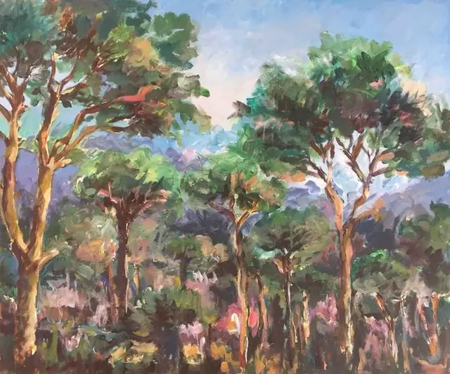 Umbrella pines against blue mountains