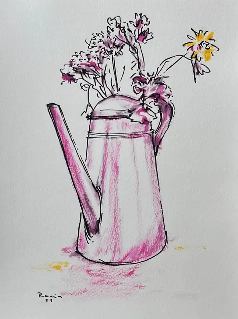 Dried flowers in a pink watering can