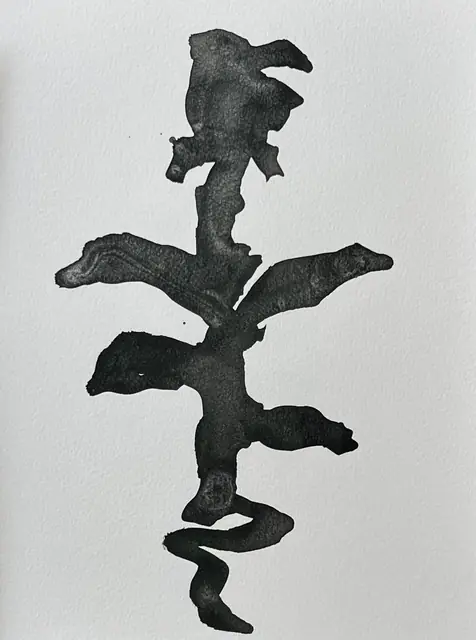 A rose stem in thick black ink