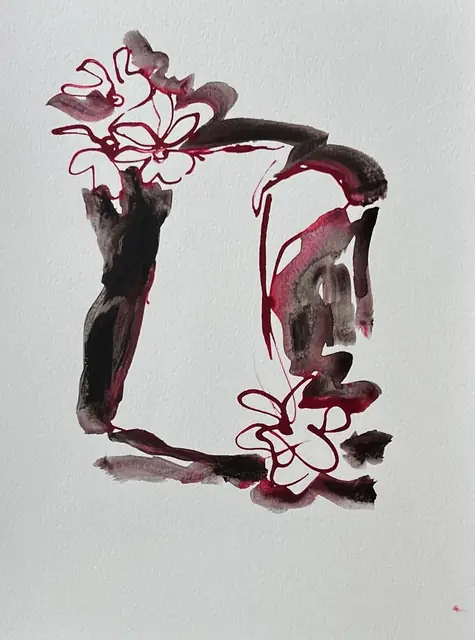 Crimson line flowers on a vase in plum and black