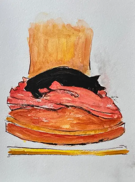 A black cat asleep on a stack of orange cushions