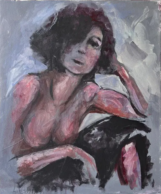 A woman resting her head on her hand, on grey-blue