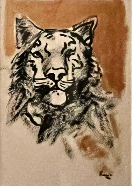 A tiger’s head in black ink, on copper