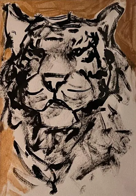A tiger’s head in quick black brushstrokes, on gold