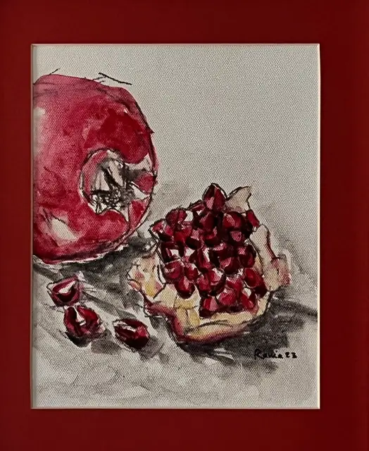 A whole pomegranate beside an open piece, in red and charcoal
