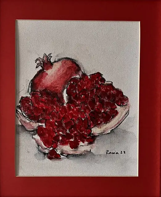 A pomegranate spilling its seeds, in red