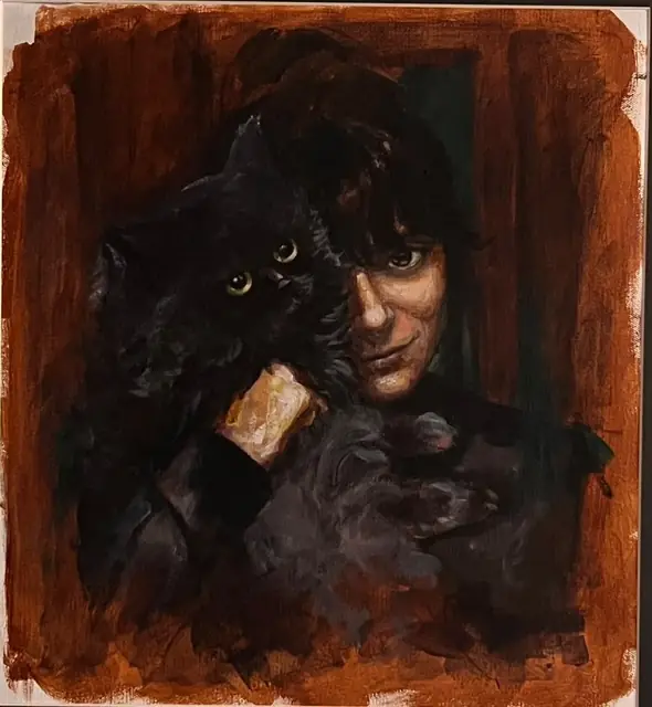A woman holding a black cat close, on rust
