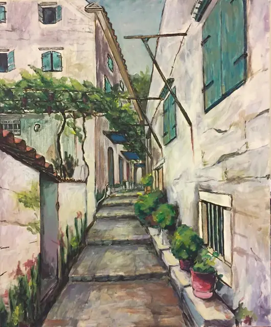 A stepped stone lane under a vine, between white houses