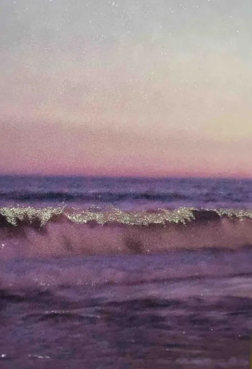 A wave at dusk, in rose and silver