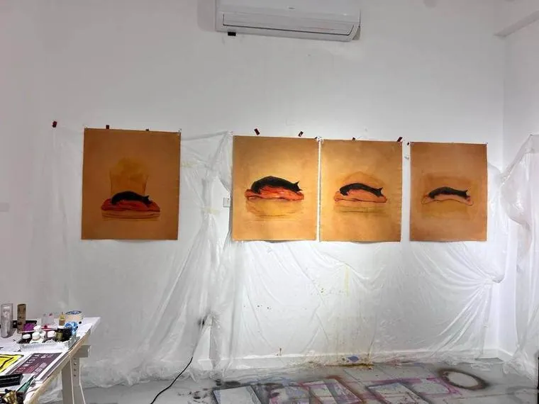 Four black cats on orange, pinned up together