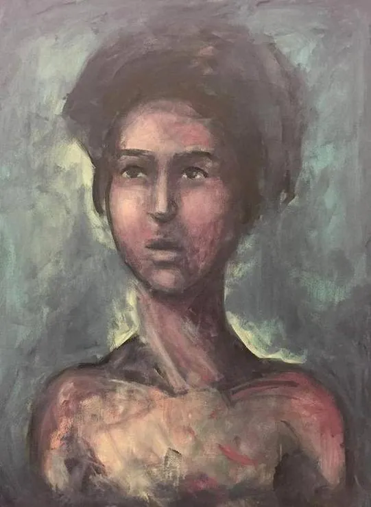 A woman with dark hair on grey-green
